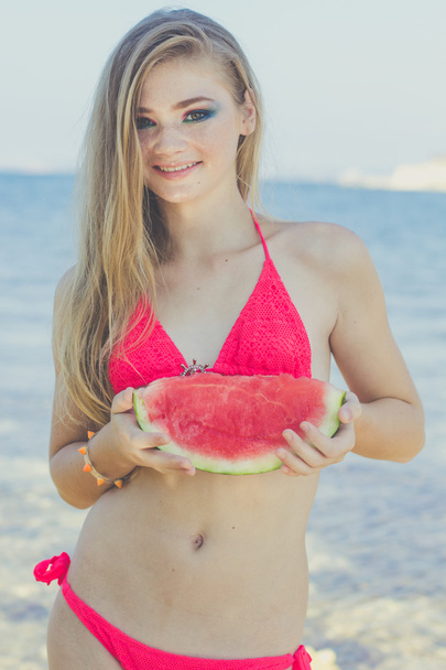 Beauty teen model girl eating watermelon - Photo, image