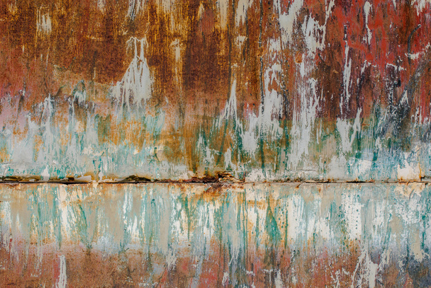 oppervlak van roestig ijzer met resten van oude verf textuur achtergrond - Foto, afbeelding