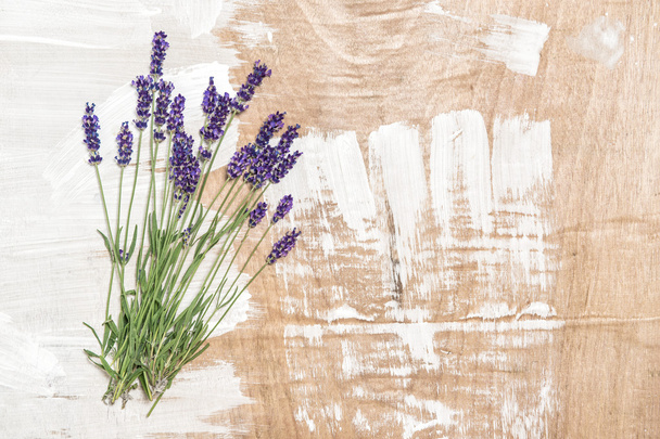 Lavender flowers on wooden background. Fresh blossoms - Zdjęcie, obraz