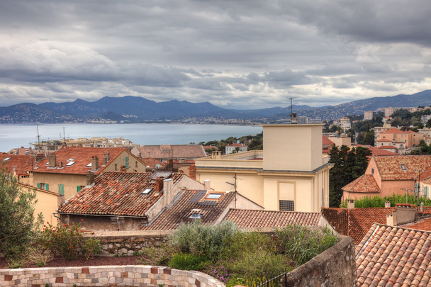 Cannes city in south France. Old Mediterranean village architecture. Travel and tourism to Europe. Old street cityscape of french riviera at sea, residential view. Summer in Provence background. - Photo, image