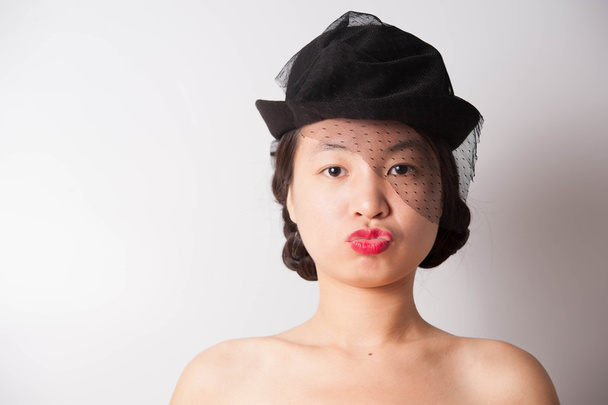 a beautiful woman with black hat - Zdjęcie, obraz