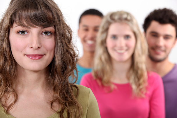 Woman standing in front of her peer group - Photo, image