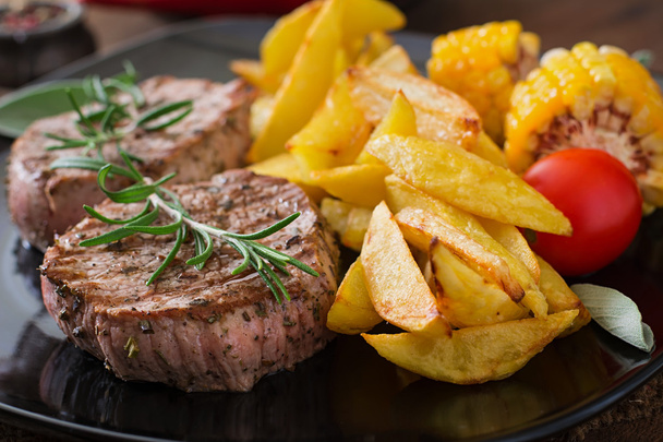 steaks  with French fries and vegetables - Photo, Image