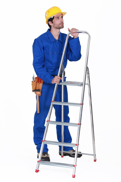 Manual worker stood with step-ladder - 写真・画像