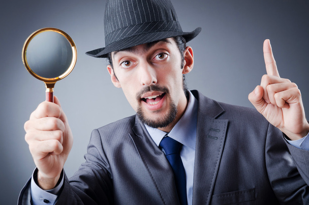 Detective and magnifying glass - Photo, Image