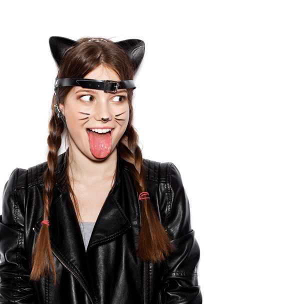 Funny girl represents as small cat having fun - Foto, imagen