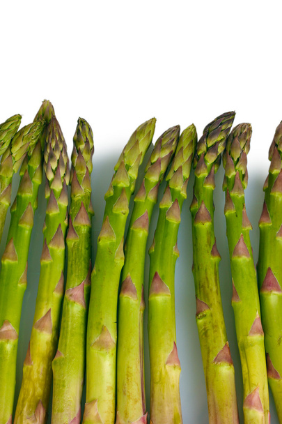 Delicious fresh asparagus isolated on white - Foto, Imagen