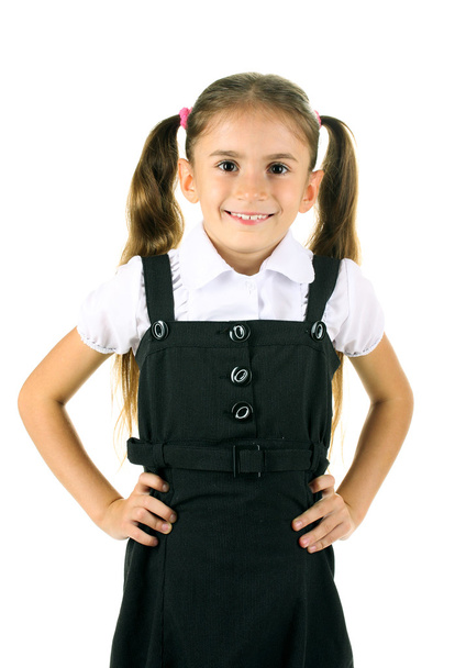 Beautiful little girl in school uniform isolated on white - Foto, Imagem