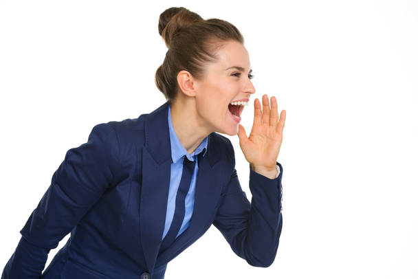 Happy businesswoman shouting and cupping hand to mouth - Foto, Imagem