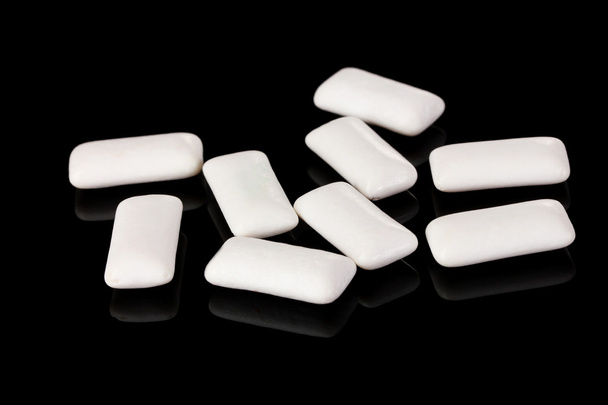 Chewing gums on black background - Foto, imagen