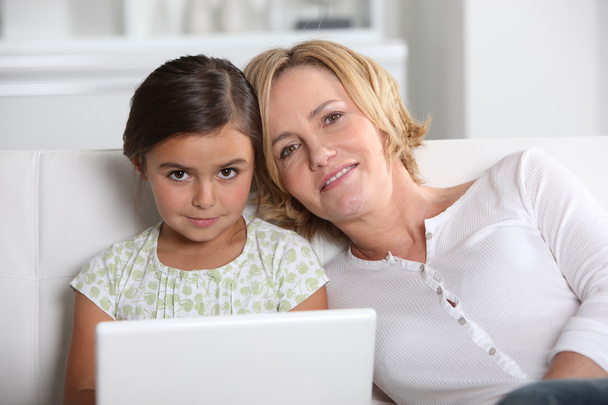 Mother and daughter on laptop - Photo, image