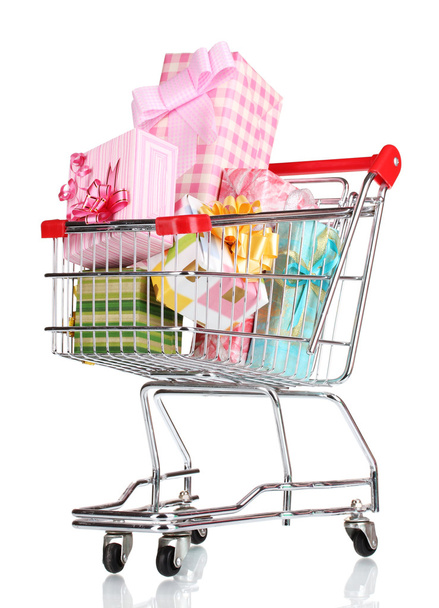 Shopping cart with bright gifts isolated on white - 写真・画像