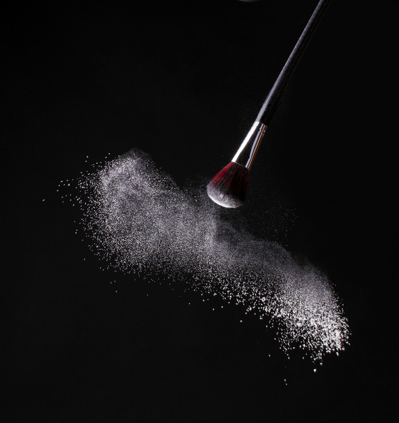 Make up brush with powder isolated on black - Foto, imagen
