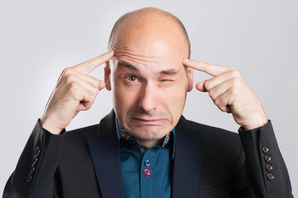 Uomo d'affari frustrato con mal di testa
 - Foto, immagini