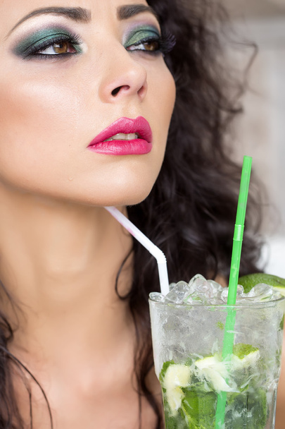 Pretty woman drinking mojito - Фото, изображение