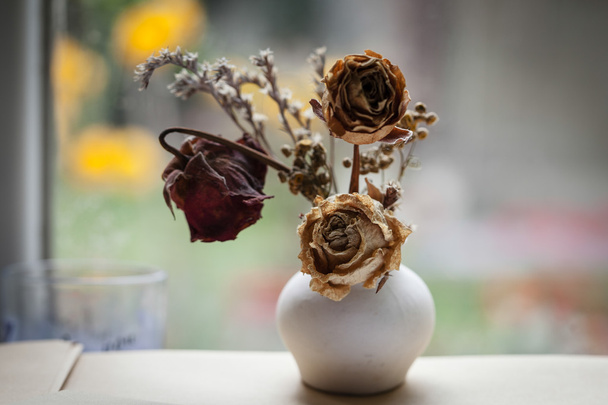 Vintage style still life with three dried roses - Photo, Image