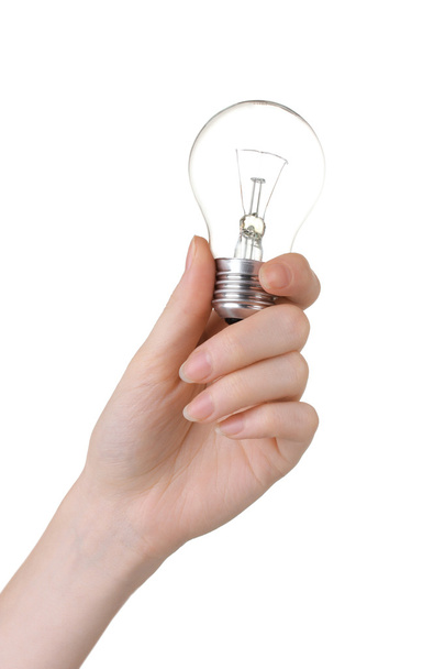 Arm holding light bulb isolated on white - Foto, afbeelding