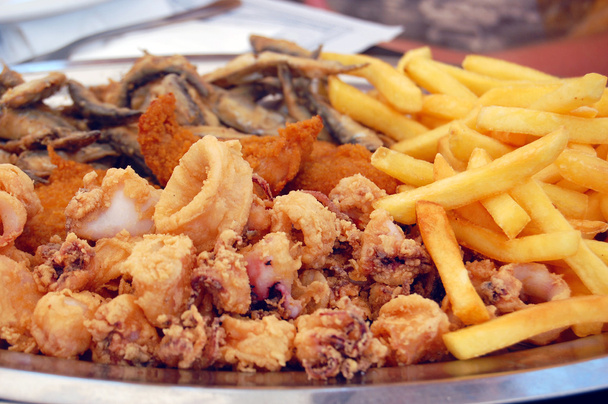 смажені морепродукти з картоплею
 - Фото, зображення