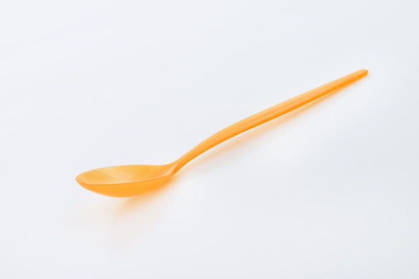 πορτοκαλί πλαστικό κουτάλι - Φωτογραφία, εικόνα