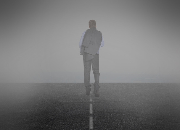 Businessman goes into the mist - Photo, Image