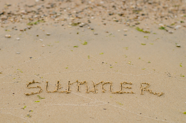Summer. Motivational phrase written in the sand sand. Photo. - Zdjęcie, obraz