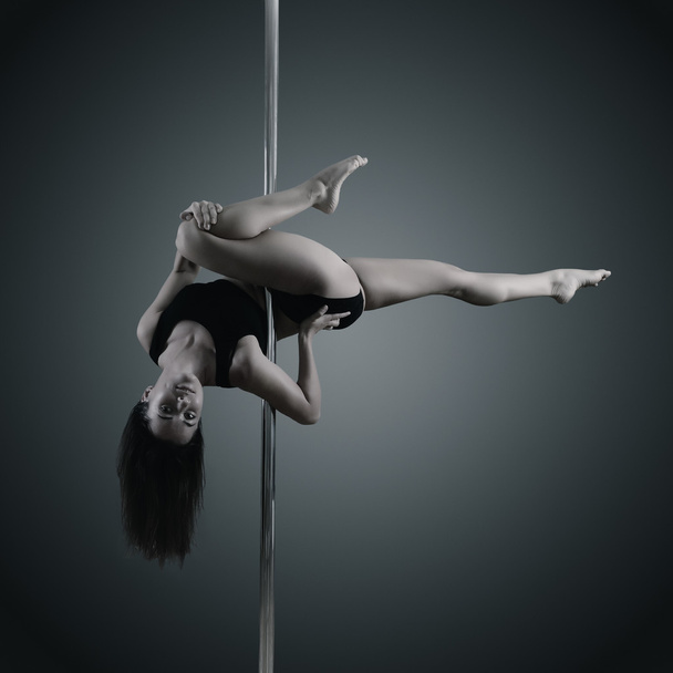 young woman dancing on pylon - Foto, immagini