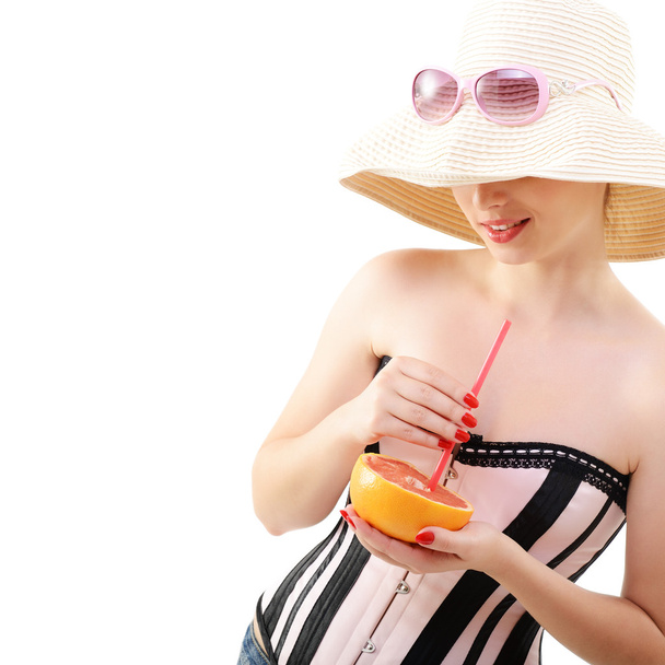 girl drinking juice of grapefruit - Photo, Image