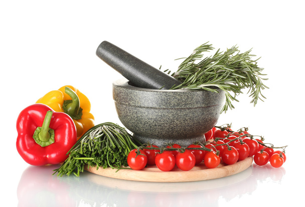 Rosemary in mortar, tomatoes cherry on wooden board, paprika and green onio - Фото, зображення