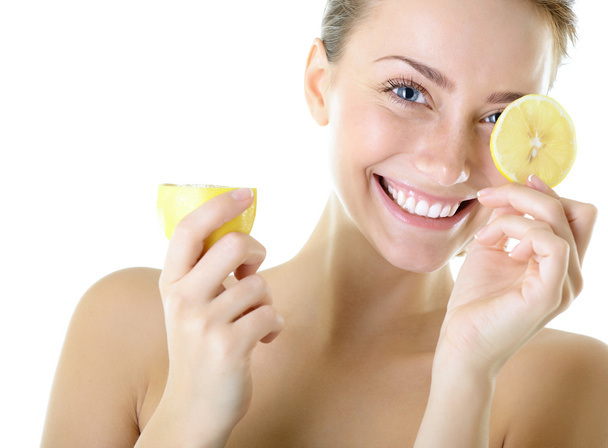 adorable smiling girl with lemon - Foto, afbeelding
