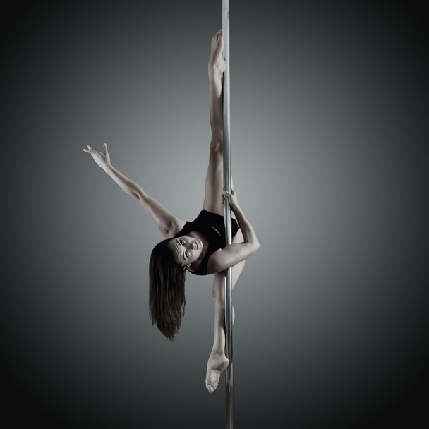 young woman dancing on pylon - Zdjęcie, obraz