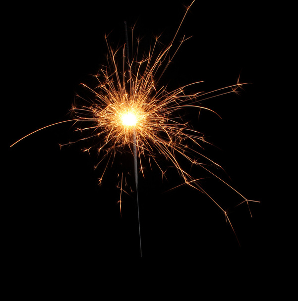 Beautiful sparkler on black background - Фото, изображение