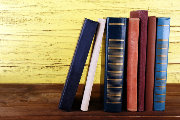 Stack of books on wooden background - Foto, Imagem