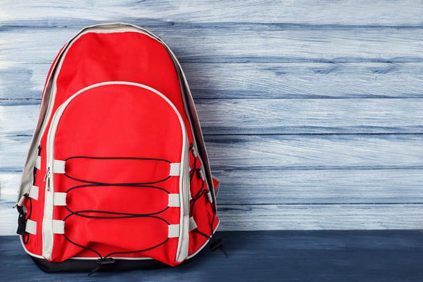 School backpack on wooden background - Fotoğraf, Görsel
