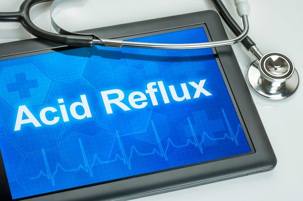 Tabletti, jonka diagnoosi on Acid Reflux näytöllä
 - Valokuva, kuva