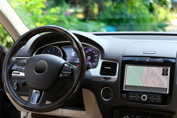 Modern car illuminated dashboard and steering wheel - Фото, изображение