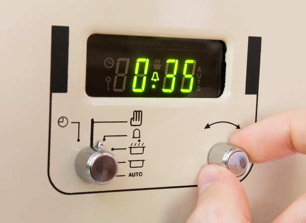 Definir um temporizador de fogão para 35 minutos
. - Foto, Imagem