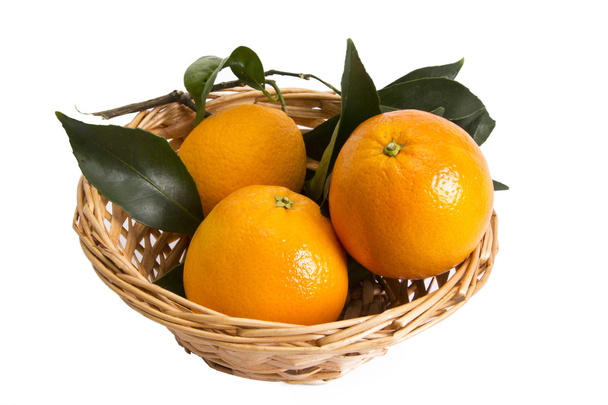 Basket of oranges isolated - Foto, afbeelding