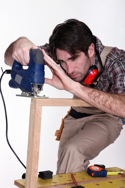 Craftsman working with a drill - Фото, зображення