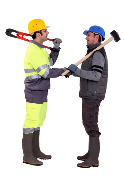 Male construction workers shaking hands - Foto, afbeelding