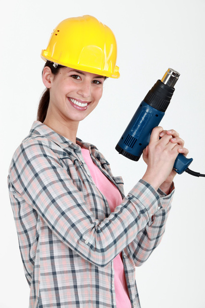 Woman holding electric heater - Fotó, kép