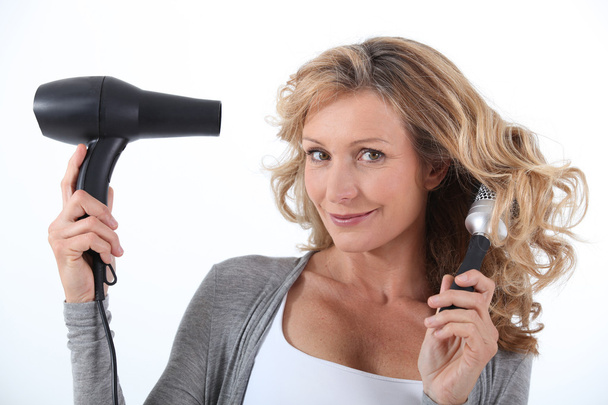 Woman with hair dryer - Zdjęcie, obraz