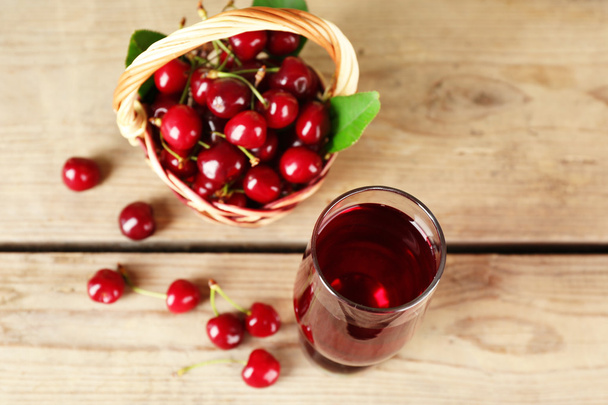 Glass of fresh juice with cherries - 写真・画像