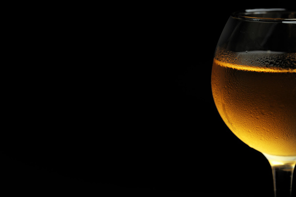 Glass of wine on dark background - Foto, Imagen