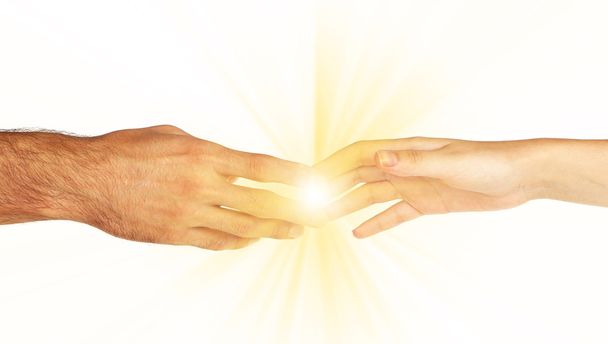 Woman and man hand attracted to each other with light isolated on white - Foto, Bild
