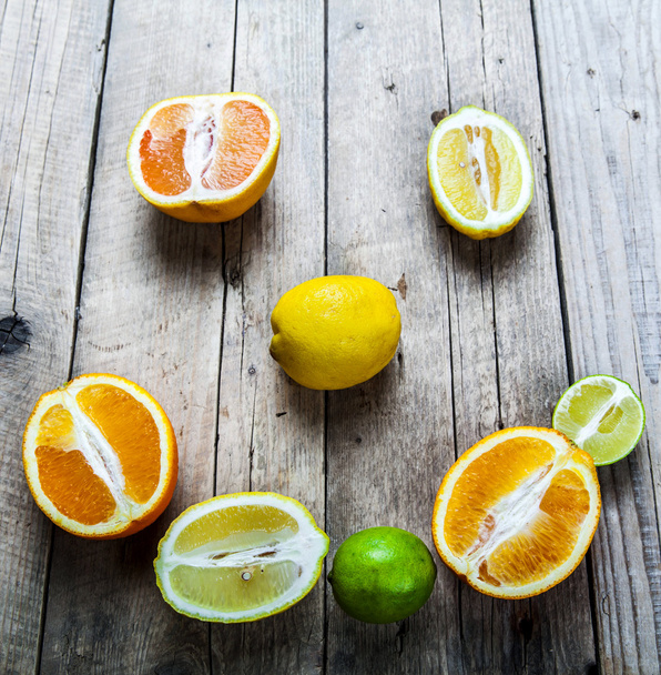 Smile of citrus on a wooden background. food, fruit - Photo, image