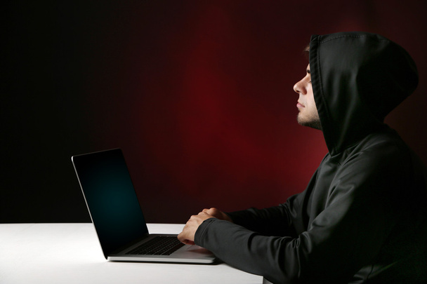 Hacker with computer and laptop - Foto, Imagen
