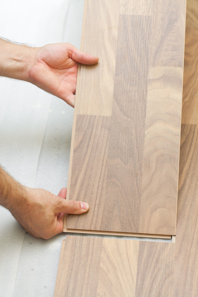 Installing wooden laminate planks - Фото, изображение