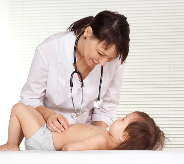 Female Doctor with child - Фото, изображение