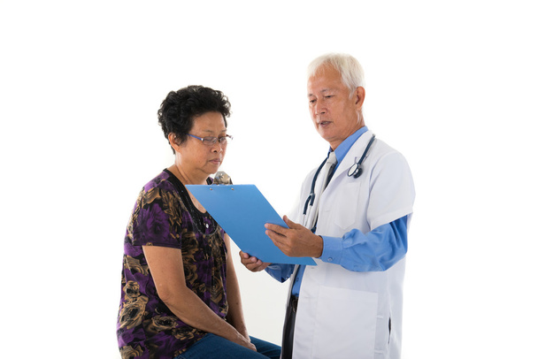 Asian   doctor with female patient - Foto, Imagem