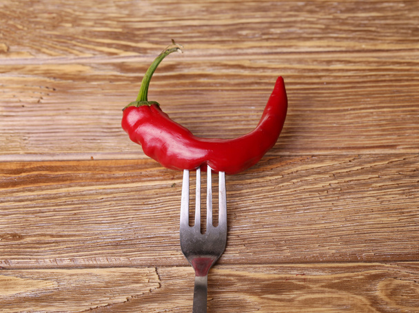 Chilli peppers and wood texture , background. - Foto, Imagem